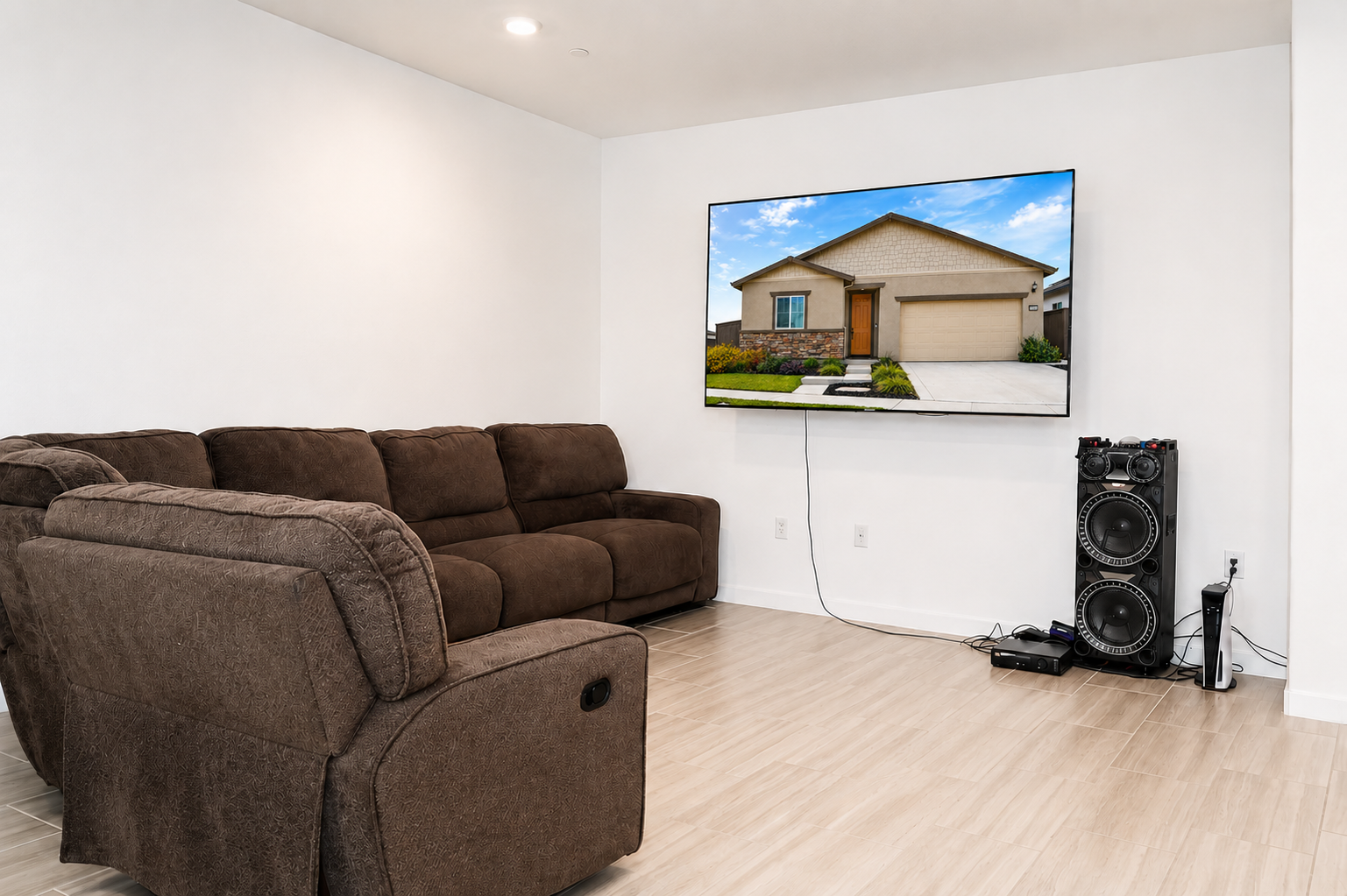 Family room with mounted TV and sectional