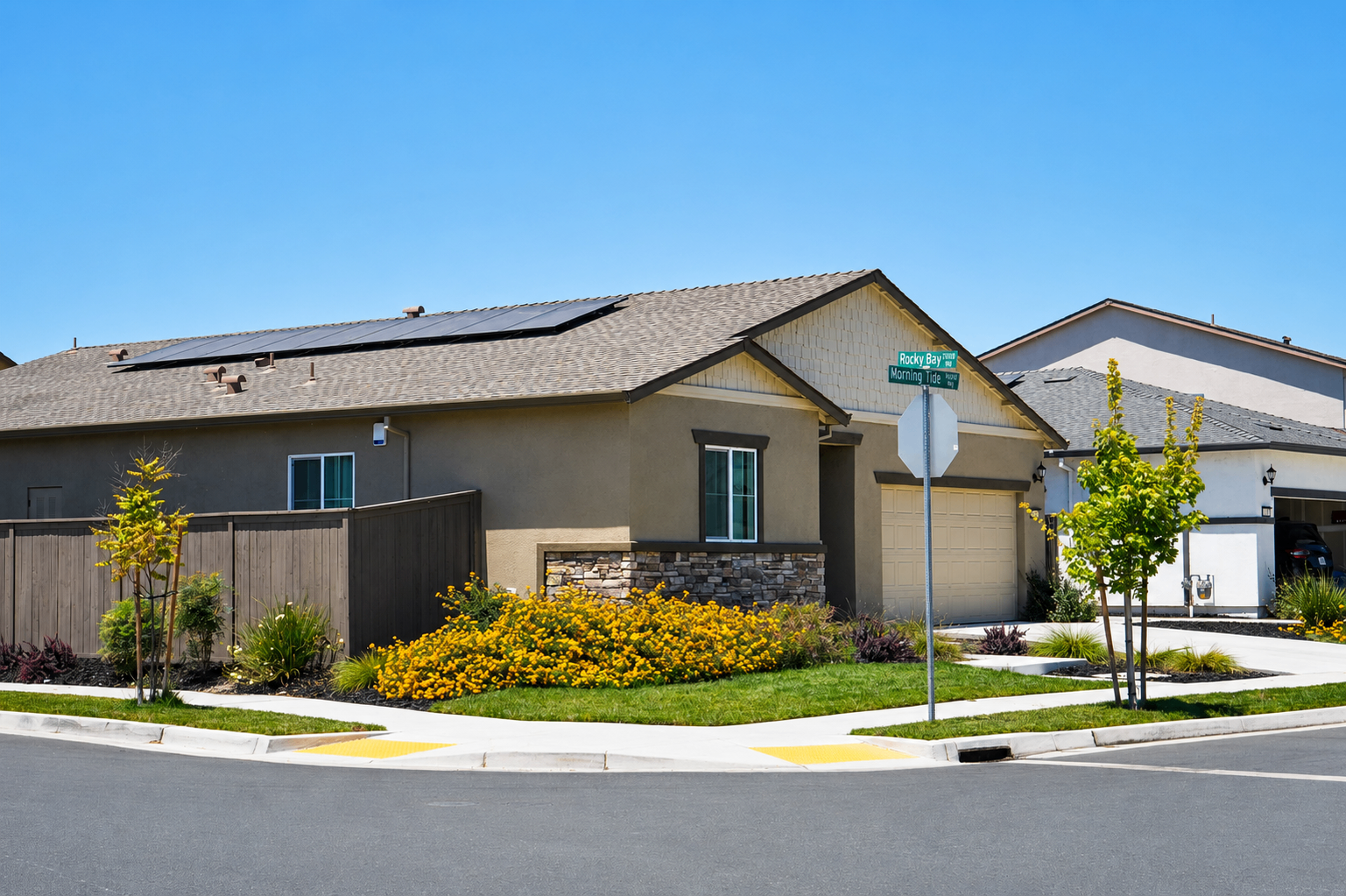Corner lot exterior showing paid solar panels and Morning Tide Way street sign