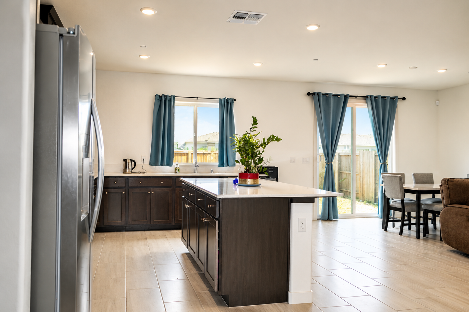 Open kitchen and dining with sliding-door yard access
